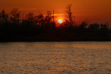 A scenic sunset view of the Cape Fear River in Wilmington, North Carolina. 