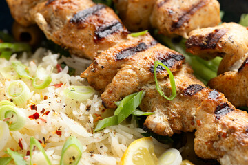 Greek grilled chicken skewers served with lemon rice and marinated green olives