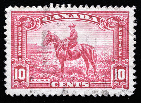 Ukraine, Kiyiv - February 3, 2024.Postage stamps from Canada.Royal canadian mounted policeman on vintage postage stamp.circa 1935.