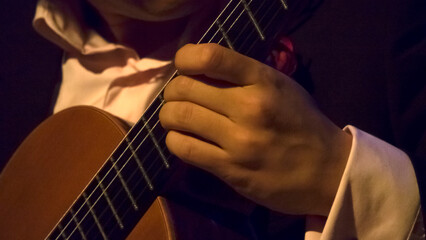 Playing the acoustic guitar