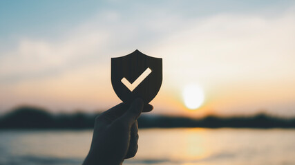 Silhouette of Businessman holding shield protect icon, Security protection and health insurance....