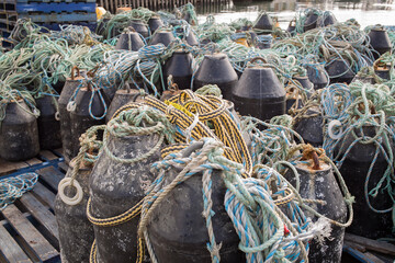 View oClose up detail of buoys and rope on salmon fish farmf salmon fish farming pens
