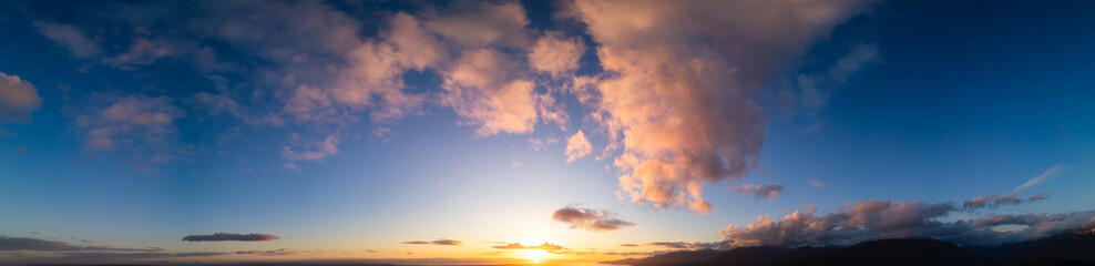 Cloudy Sunset Sky Panorama. Cloudscape Nature Background.