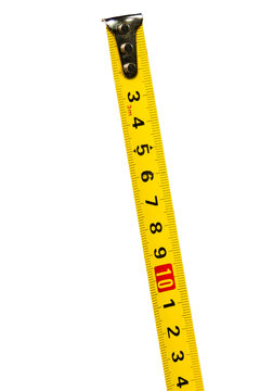 Yellow tape measure isolated on neutral background. Measurement concept. Masonry concept
