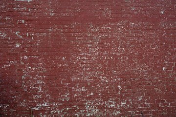 Peeling red painted wall