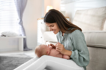 Mother with her newborn baby at home