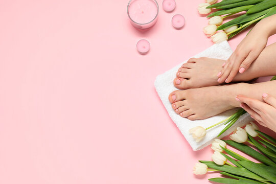 Fototapeta Closeup of woman with neat toenails after pedicure procedure on pink background, top view. Space for text