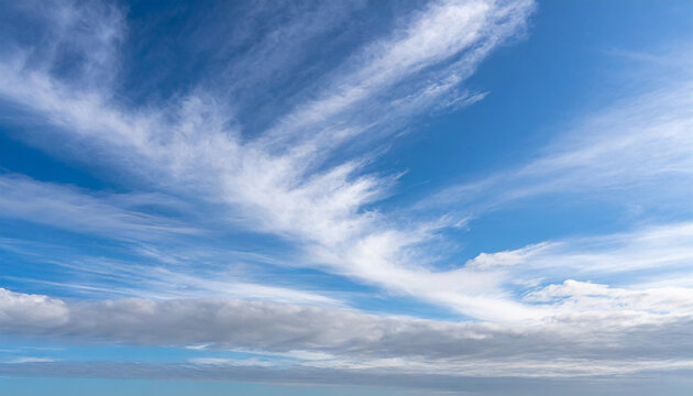 Beautiful blue sky with white wispy clouds, a perfect replacement background for photos
