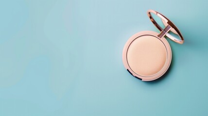 An elegant makeup powder compact with a mirror evokes beauty and preparation, set against a soft teal background