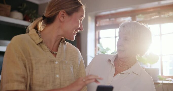 Phone, conversation and woman with senior mom helping on social media, app or internet. Discussion, technology and female person talking, bonding and explaining cellphone to elderly mother at home.