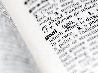 closeup of the word goal in the dictionary