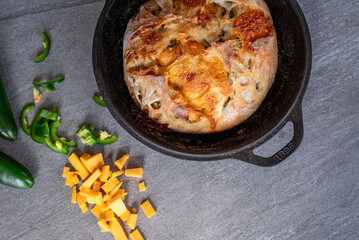 Fresh sourdough bread with jalapeño and cheddar cheese