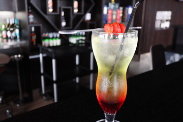 fresh and cold drink in a glass with strawberry slice fruit