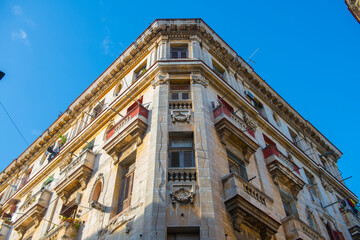Fototapeta na wymiar Historic buildings on Calle Compostela Street at Calle Amargura Street in Old Havana (La Habana Vieja), Cuba. Old Havana is a UNESCO World Heritage Site. 