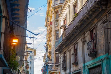 Zelfklevend Fotobehang Historic buildings on Calle Compostela Street at Calle Amargura Street in Old Havana (La Habana Vieja), Cuba. Old Havana is a UNESCO World Heritage Site.  © Wangkun Jia
