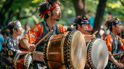 A group of traditional taiko drummers performing at a Golden Week festival showcasing the lively and festive atmosphere of this holiday. - obrazy, fototapety, plakaty