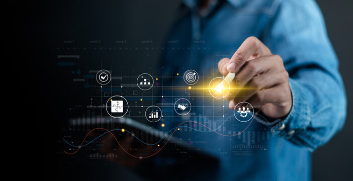 Project management concept, Planning the successful and efficient implementation of the project in the specified time period. Businessman touching project management icon on virtual screen.