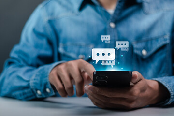 Sosial media chat concept. social media marketing technology. Live Chat Chatting on application. Person typing on smartphone chatting conversation in chat box icon pop up.