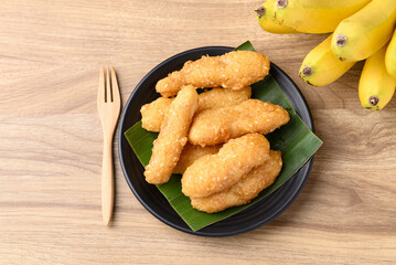 Deep fried banana with flour and sesame, Thai street food, Table top view
