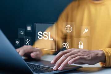 SSL, Secure Socket Layer concept. Data encryption technology to increase the security of communication or data transmission on network. Person using laptop with SSL icon on virtual screen.