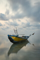 Traditional fishing boat at low tide in Havelock island, Andaman islands.