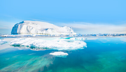 Melting of a iceberg and pouring water into the sea - Greenland - Tiniteqilaaq, Sermilik Fjord, East Greenland