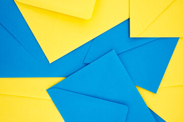 Blue and yellow envelopes organized in symmetrical pattern
