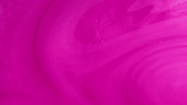 Pink mist. Glitter fluid. Defocused bright pink color shimmering particles texture paint water swirl floating abstract art background.