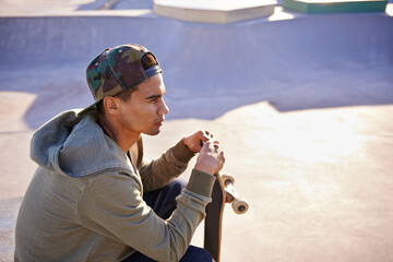Thinking, skateboard and man at a skate park with idea for trick, stunt or adrenaline sports...