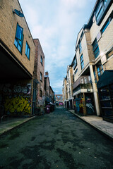 Fototapeta premium Dark Ghetto street with grafitis in london