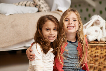 Happy, hug and portrait of children in bedroom for relaxing, bonding and playing with toys in home....