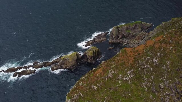 Drone footage of the Slieve League Cliffs on coast of Ireland on an overcast day.