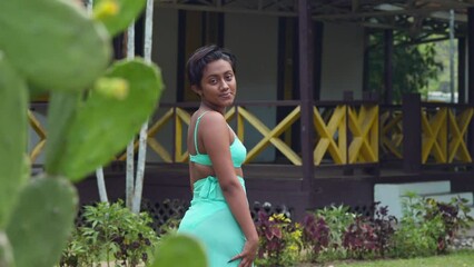 Amidst the historical charm of Lopinot Historical Park Complex on Trinidad, a young girl in swim attire immerses herself in the experience.
