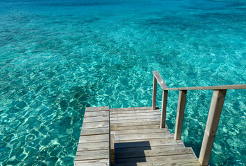 Stairs down with  leisure of  wooden balcony to seaside tropical in summer holiday ,Maldives