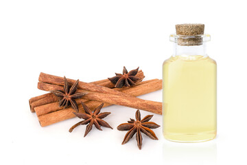 Cinnamon essential oil in glass bottle isolated on white background.