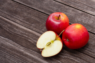 red apples on wooden table