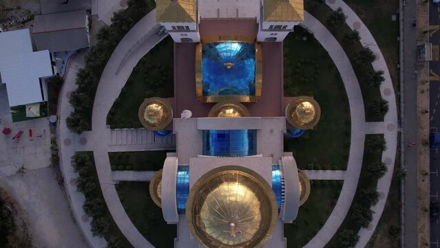 Top Aerial View, Orthodox Church in Bar, Montenegro. Golden and Blue Domes anc Cupola, High Angle Drone Shot