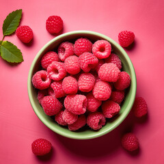 Organic, natural, fresh and healthy red raspberries in a fruit bowl, pink fruit background 