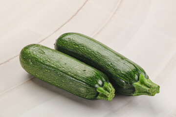 Raw green ripe zucchini vegetable