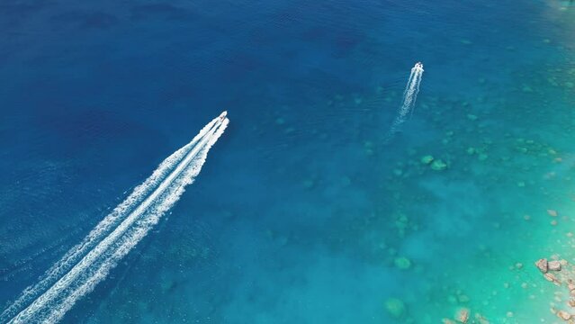 Boats against the backdrop of the blue sea from a bird's eye view near the Mizithres rock in the Ionian Sea. Keri, Zakynthos island in Greece.