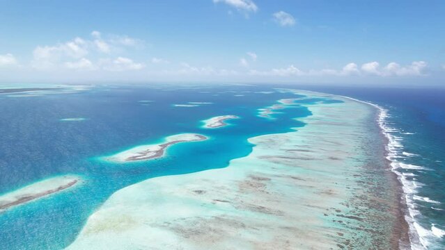 The eastern barrier of los roques with clear blue waters, aerial view