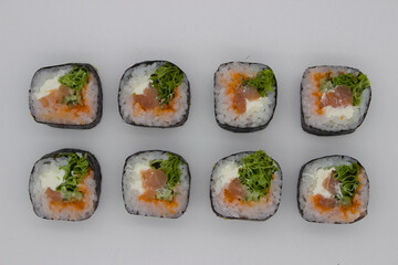 Fresh Salmon Sushi Rolls on White Background