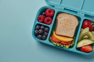 Plastic lunch box. with a sandwich inside on a blue background. Delicious snack for a trip