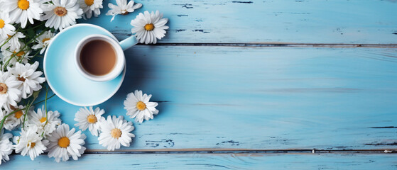 Top view image of daisy flowers next to cup of coffee