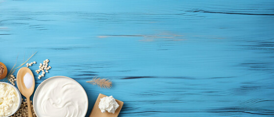 Top view photo of dairy products over blue wooden background