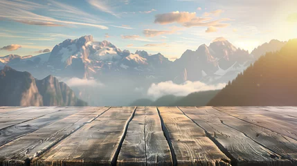 Foto op Canvas A wooden deck overlooking a mountain range with a clear blue sky. The view is serene and peaceful, with the sun shining brightly on the mountains. The wooden deck is a perfect spot to relax © wanchai