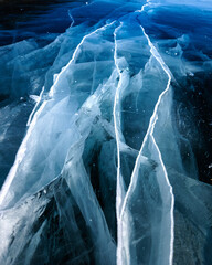 Cracks surface of the frozen lake of Baikal lake in winter season. ice texture cracks baikal,...