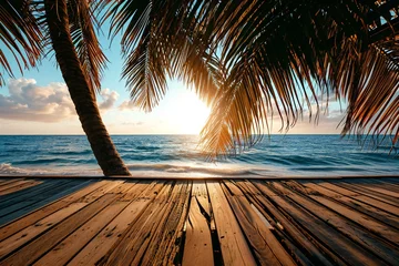 Raamstickers Beautiful sunset on the beach with palm trees and wooden pier © Quantum