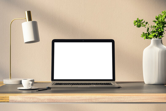 Elegant laptop on wooden desk with modern lamp and plant, serene workspace concept. 3D Rendering