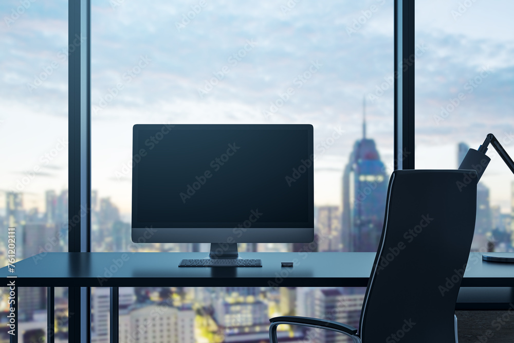Poster Clean office interior with empty computer monitor on desk and panoramic windows with beautiful city view and daylight. Mock up. Workplace concept. 3D Rendering.